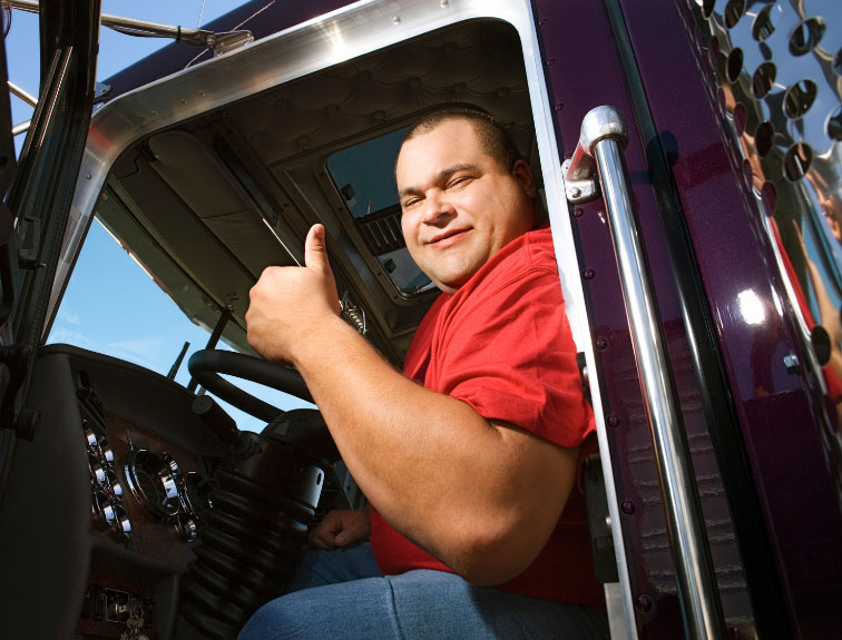 OTR Driver beside a semi truck